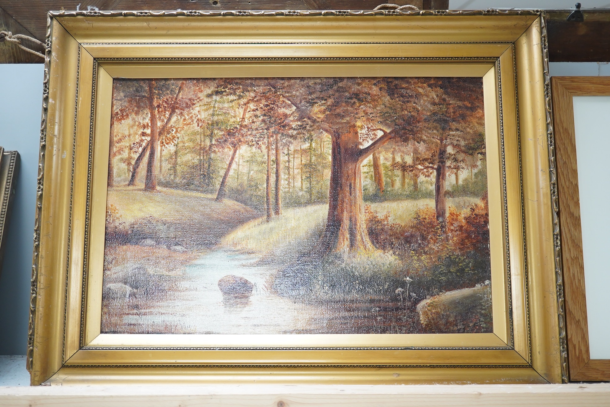 H E Austin, oil on canvas, Woodland landscape with stream, signed, 27 x 40cm, gilt framed. Condition - good